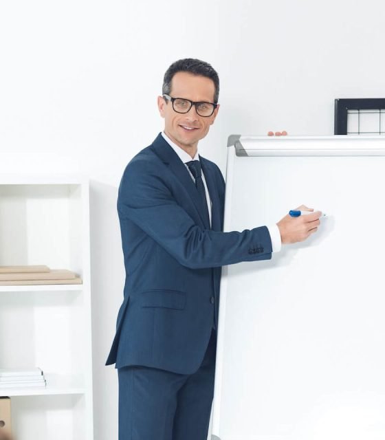 smiling-mature-businessman-giving-presentation-at-2022-11-02-02-01-41-utc-e1671073296999.jpg